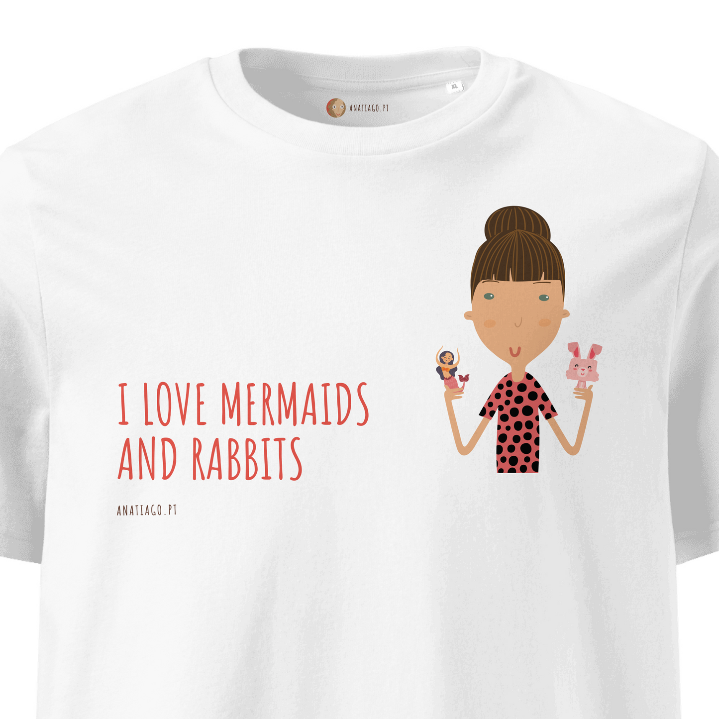 White t-shirt with a cartoon of a girl holding a mermaid and a rabbit, and text 'I Love Mermaids And Rabbits'.