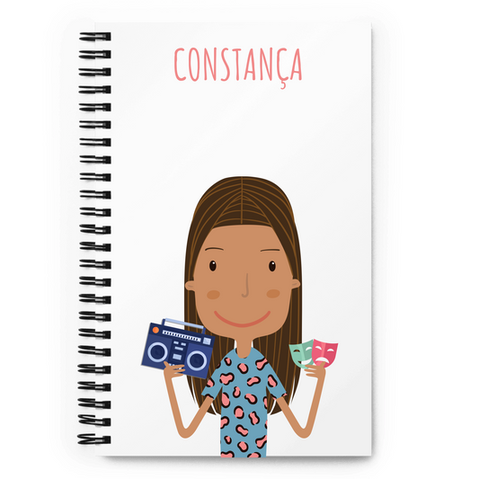 Notebook with a cartoon character holding a boombox and tickets, with 'Constáncia' written above. To customize